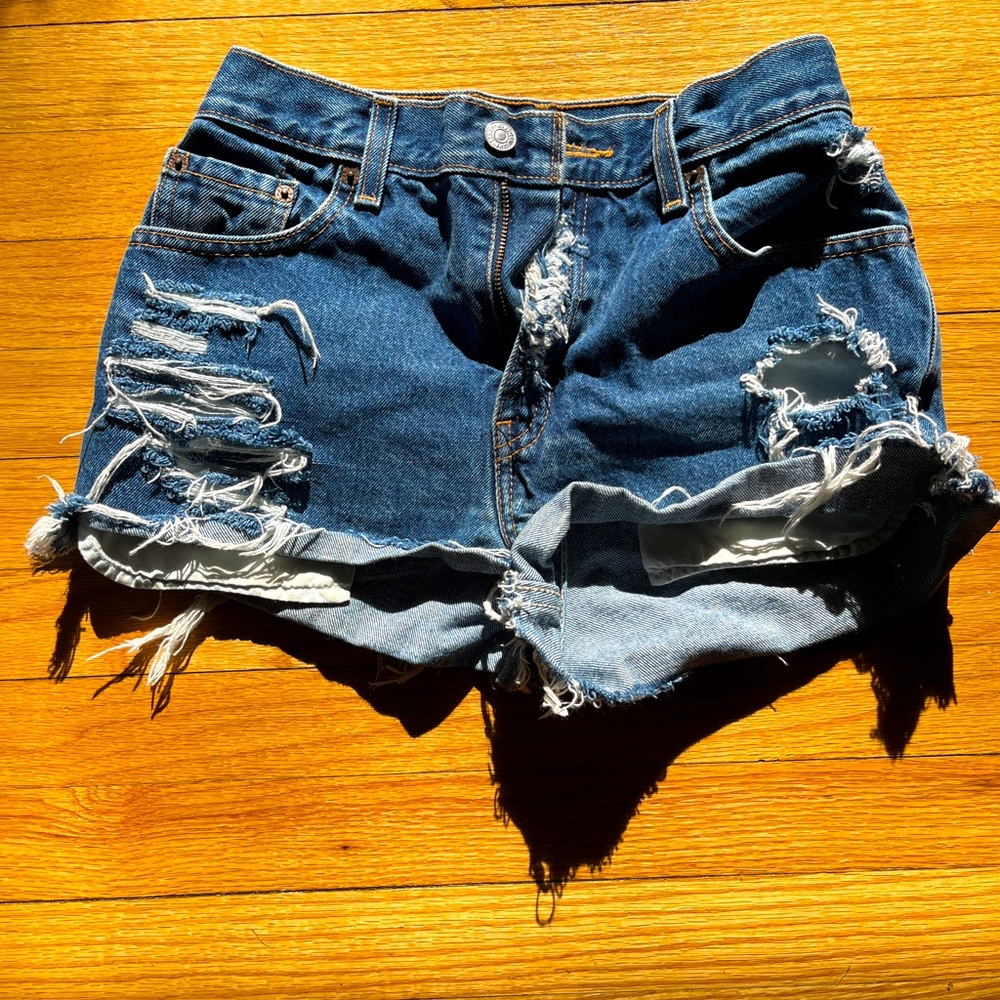 Vintage custom distressed high-waisted Levi’s 550 denim cutoff shorts